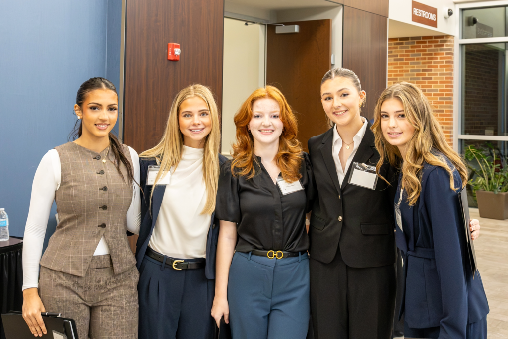 students pose for a photo at the ISM business symposium 