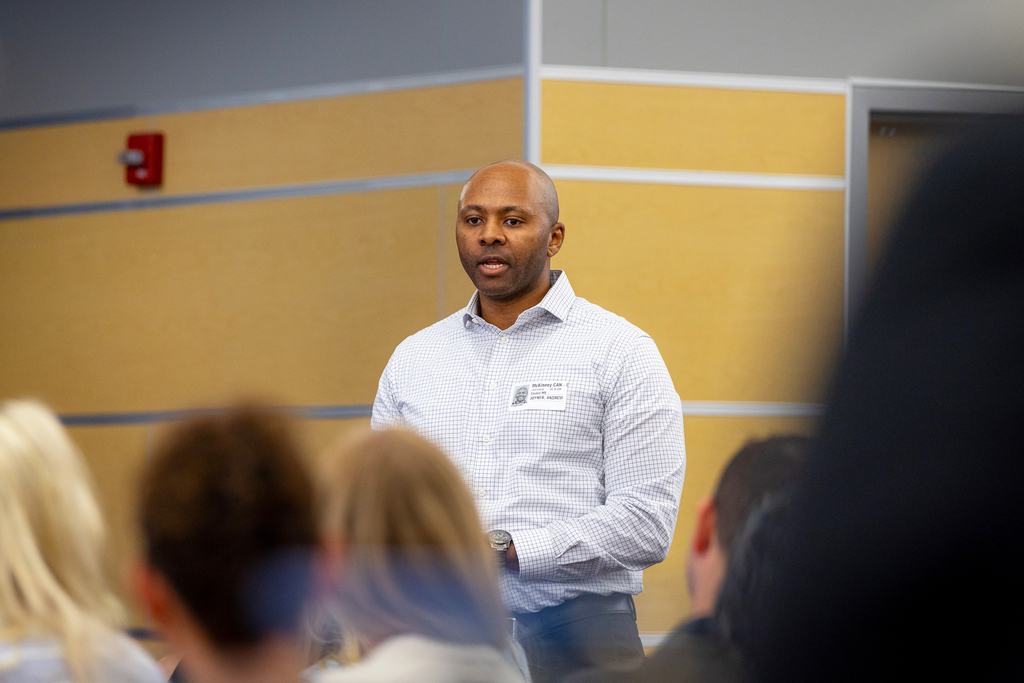 male participant standing and talking