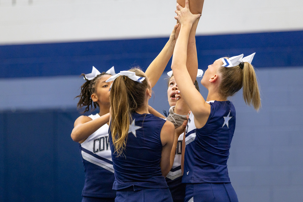cheerleaders doing a lift