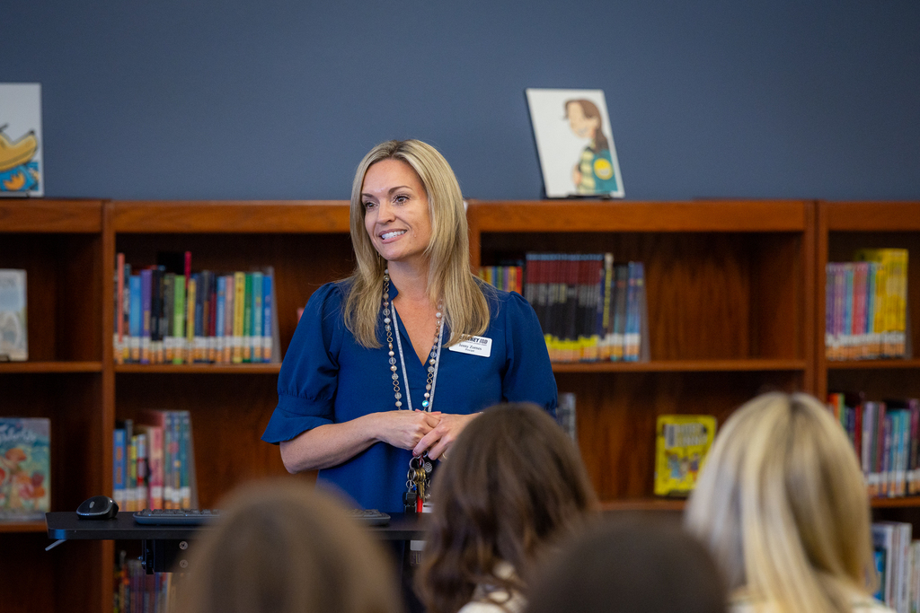 Principal Jenny Zornes talking in front of group