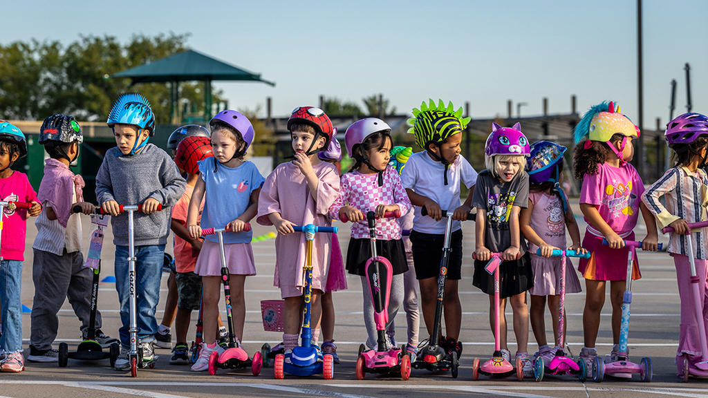 line of students waiting to start scootering