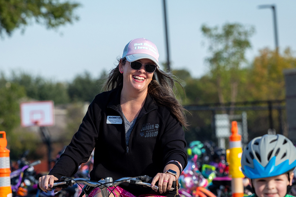 principal Kristen Patterson riding and smiling
