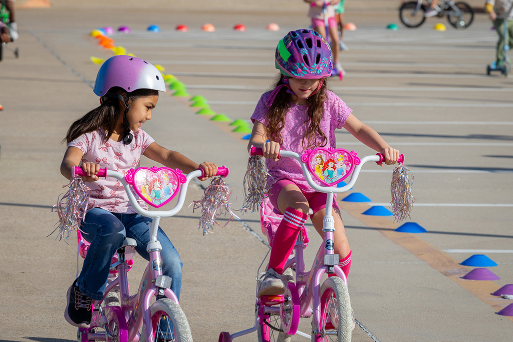 two girls riding together