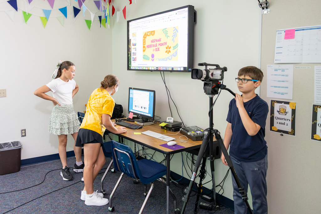 students set up the camera for morning announcements