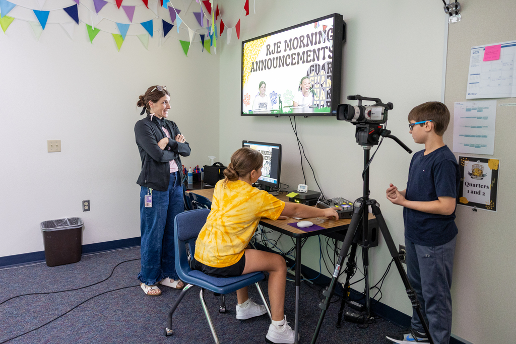 students set up the camera for morning announcements