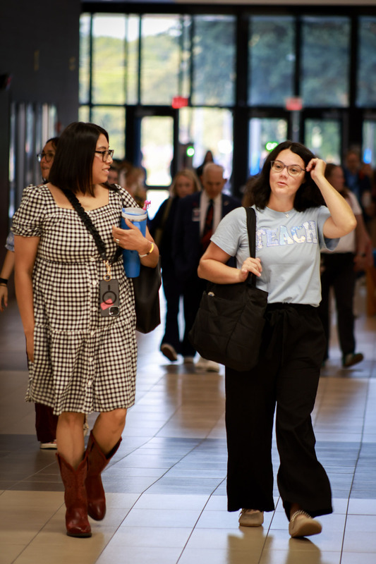 two teachers walking in