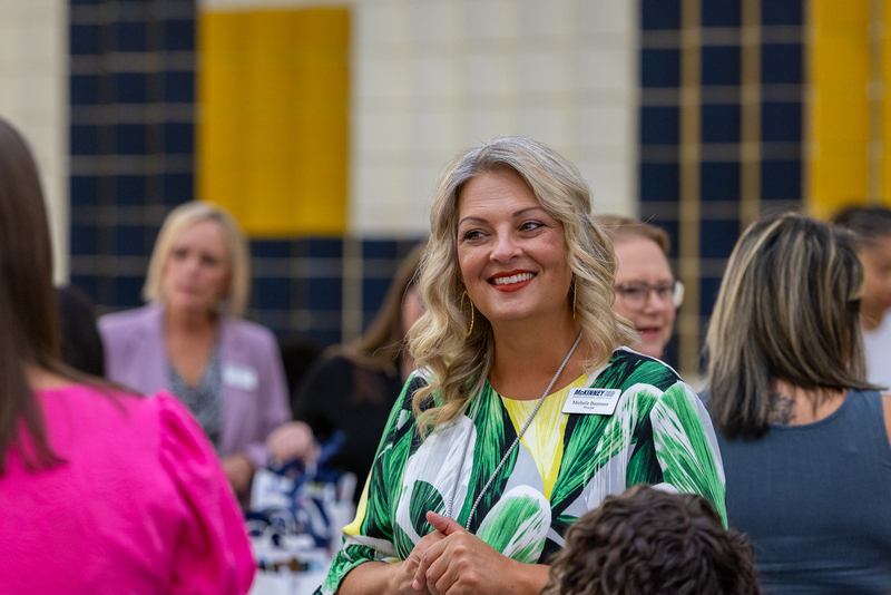 principal smiling and talking