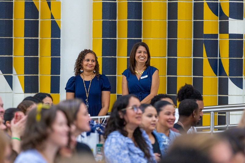 two female principals standing and smiling