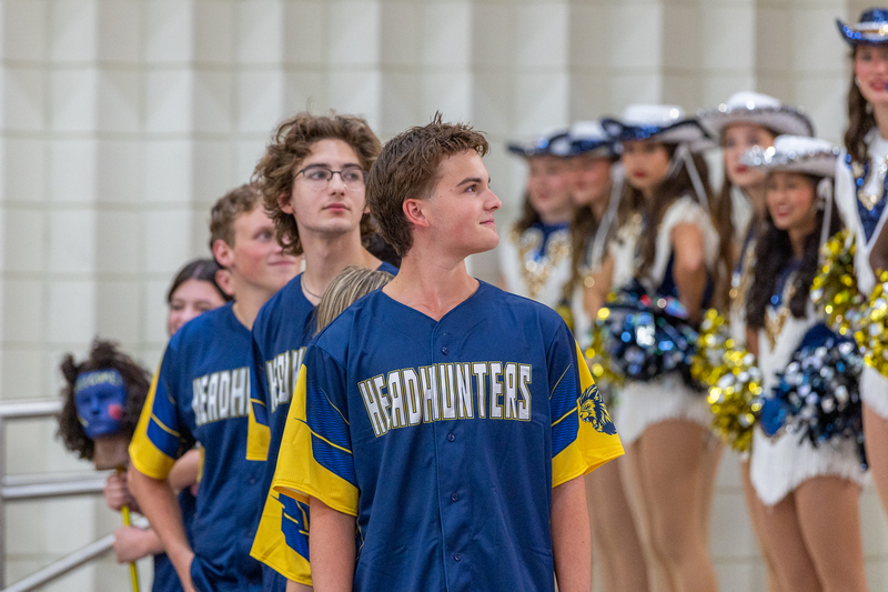 head hunters standing in a line
