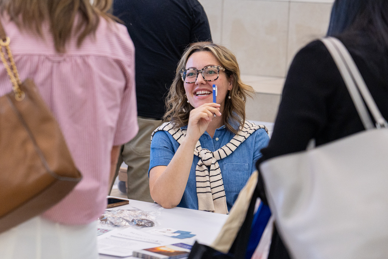 woman at booth laughing