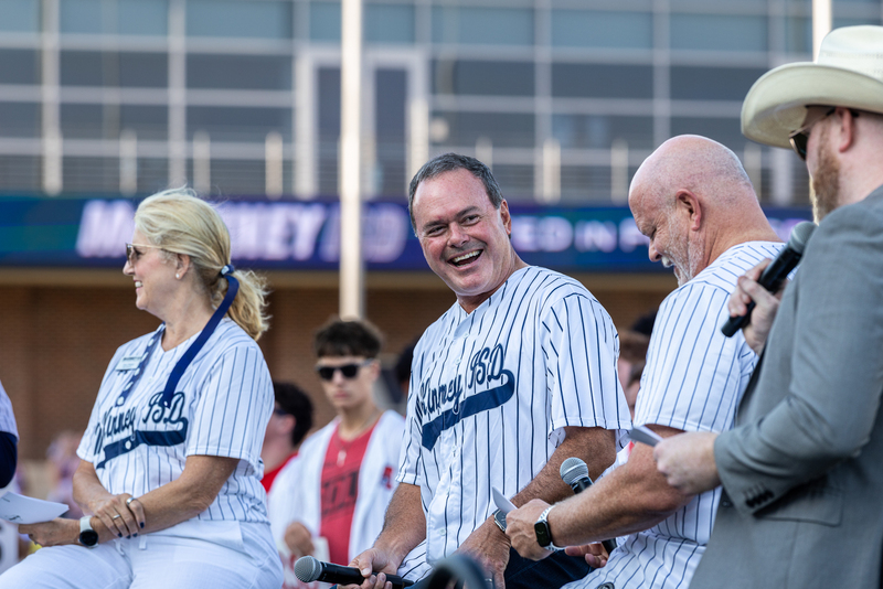 mayor bill cox onstage laughing 