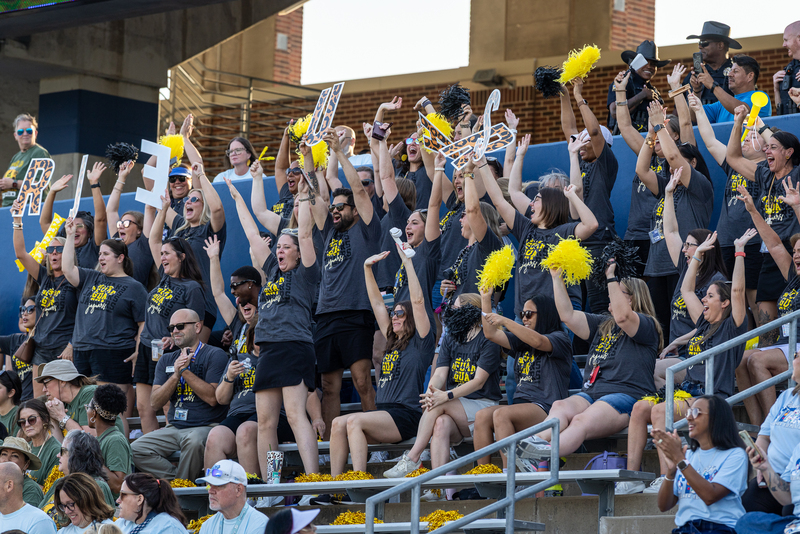 teachers cheering in the bleachers
