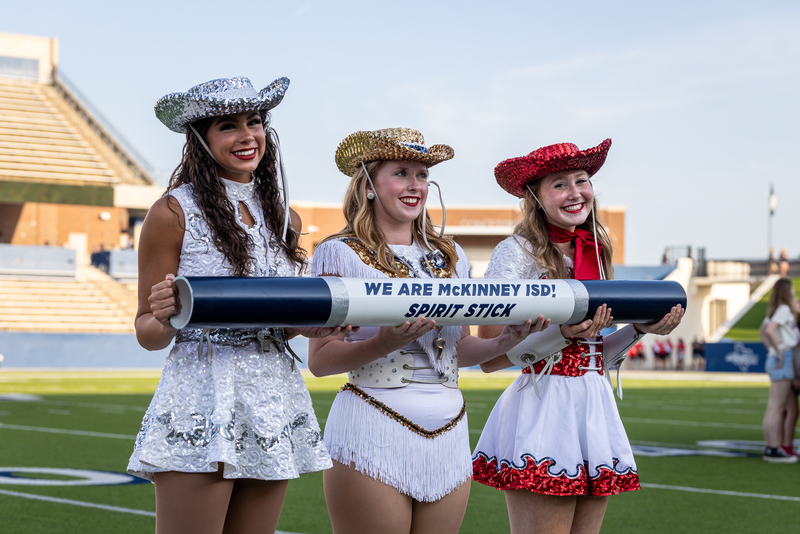 drill team captains holding spirit stick