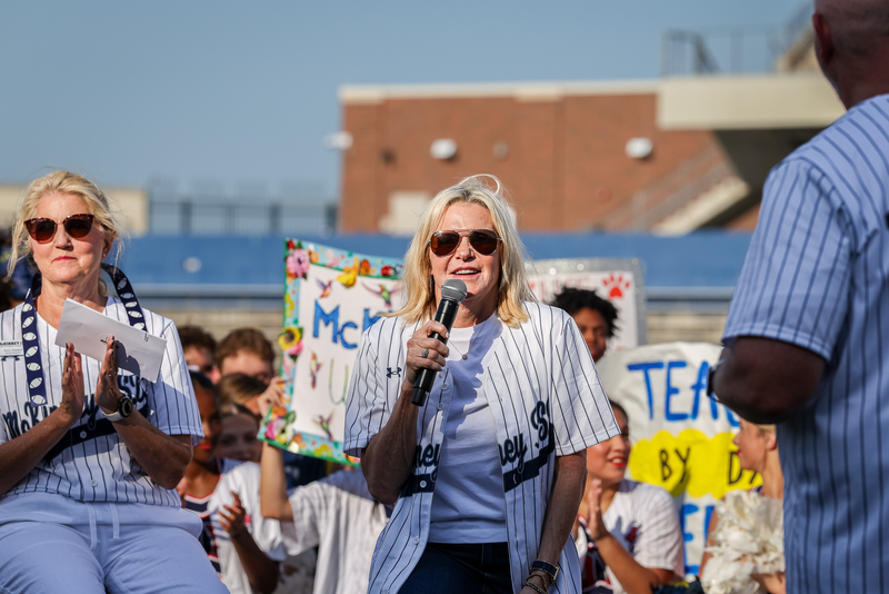 Melanie Raleeh speaking on stage