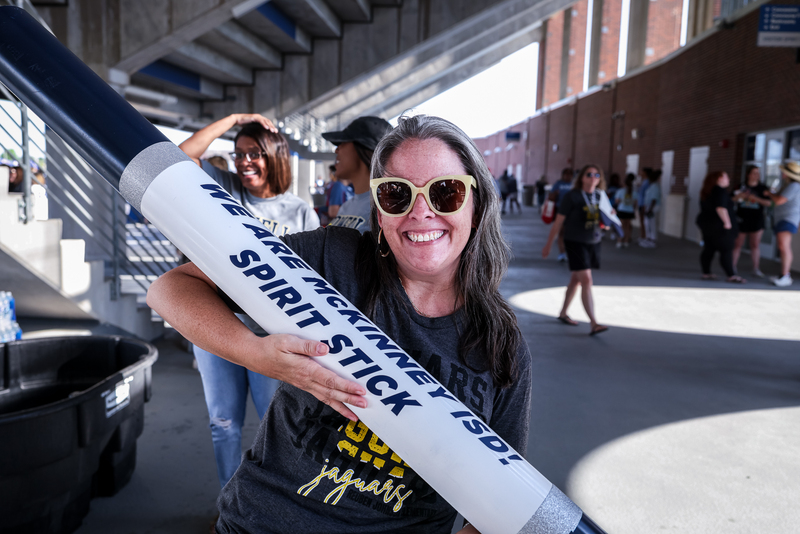 principal holding spirit stick