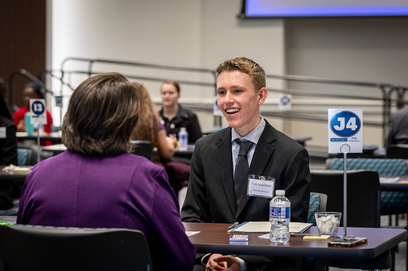 male student smiles during interview