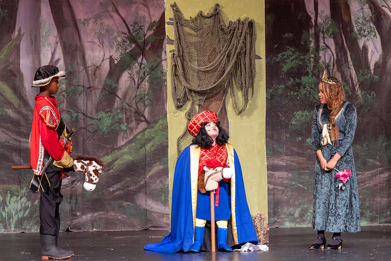 actors onstage during performance