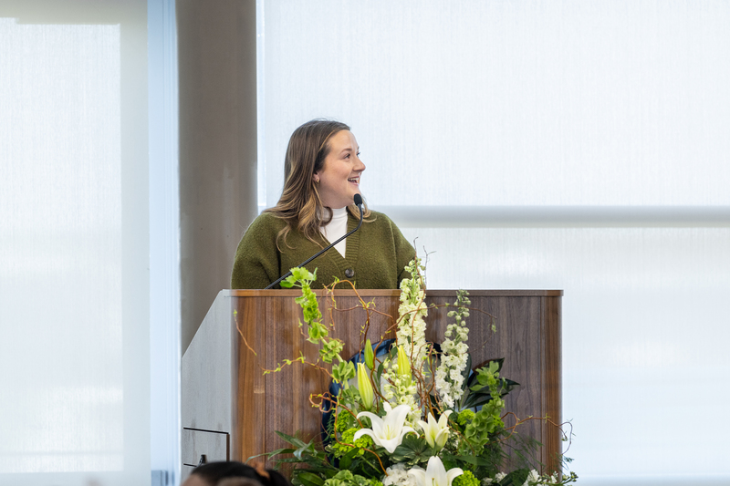 Tommy Winburn's daughter at the podium speaking after accepting the award on her father's behalf