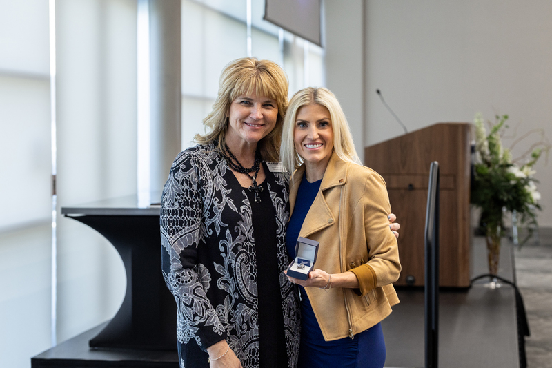 Parker standing with Jennifer Frazier holding her Hall of Honor ring