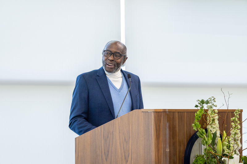 Fields at the podium smiling as he speaks