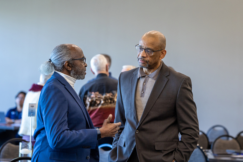 Otis Fields talking with another man before the ceremony