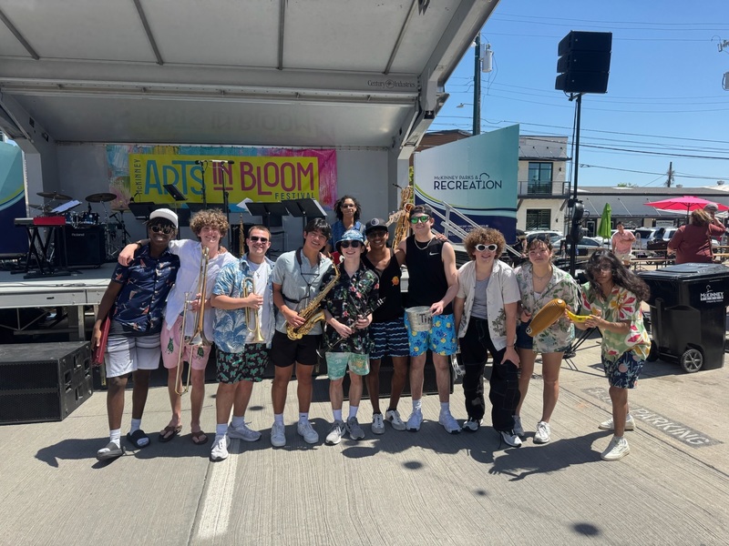 members in a casual group photo with instruments at arts in bloom festival