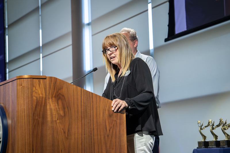 Bostick speaking at podium