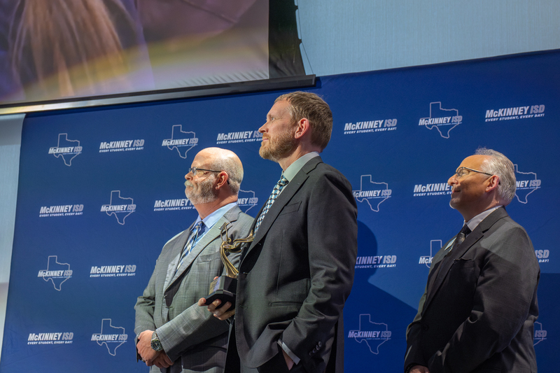 Thomas onstage watching video