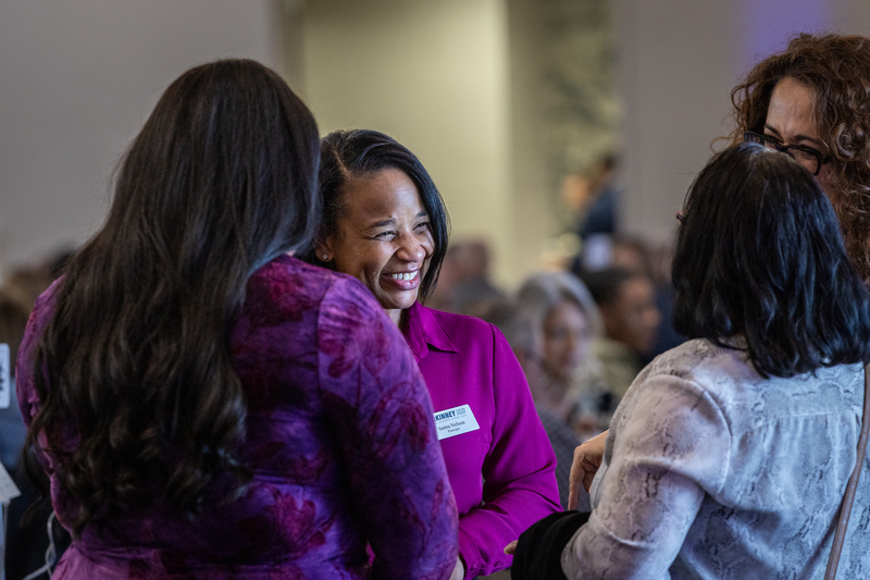 group of guests lauging and smiling