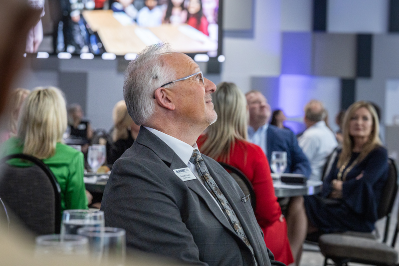 Ken Ussery looking up at screen