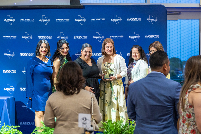 group onstage after getting a photo