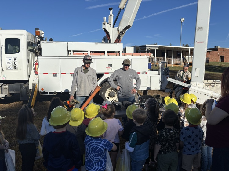students at lineman truck