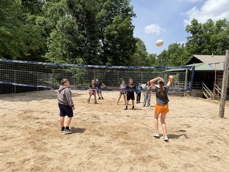 students playing volleyball