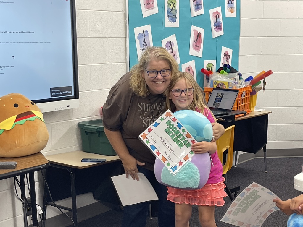 Dallie receiving her prize for reading over the summer.