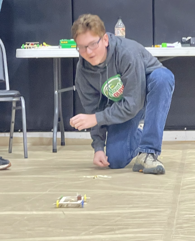 HAL Students working together to build a slingshot car. 