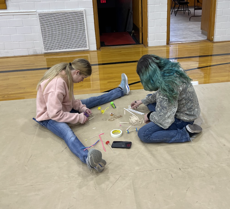HAL Students working together to build a slingshot car. 