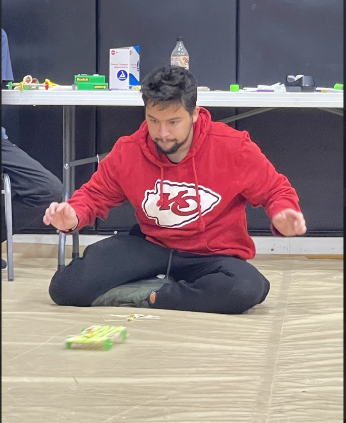 HAL Students working together to build a slingshot car. 