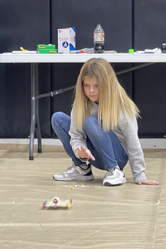 HAL Students working together to build a slingshot car. 