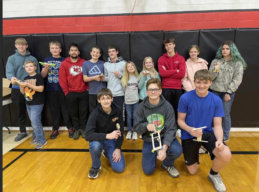 HAL Students working together to build a slingshot car. 