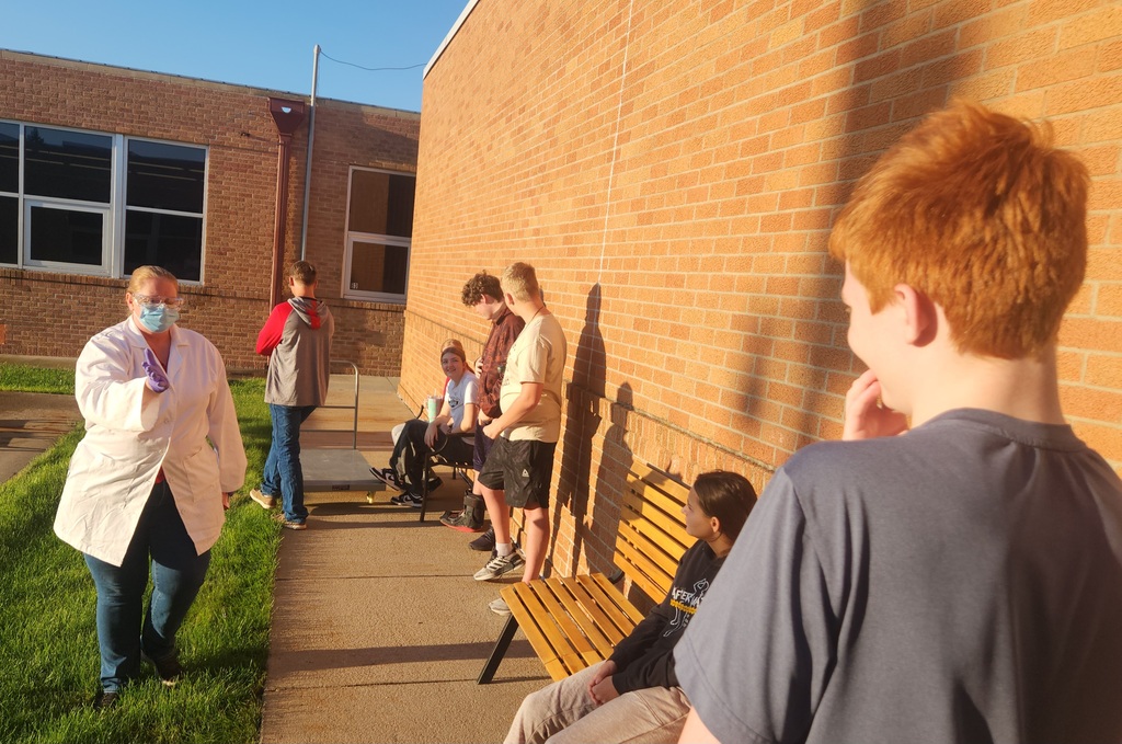 Mrs. Anderson demonstrating proper handling of chemicals.