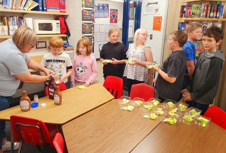 Students enjoying apples!