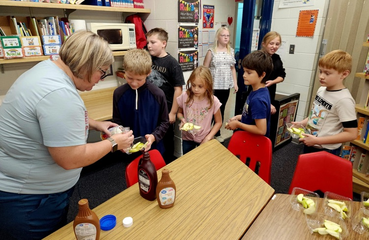 Students enjoying apples!