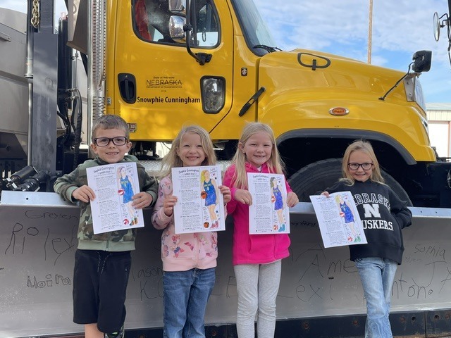 K-1 with Sophie Cunningham pictures and Snowphie plow.