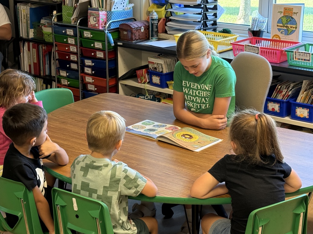 Reading to Primary students. 