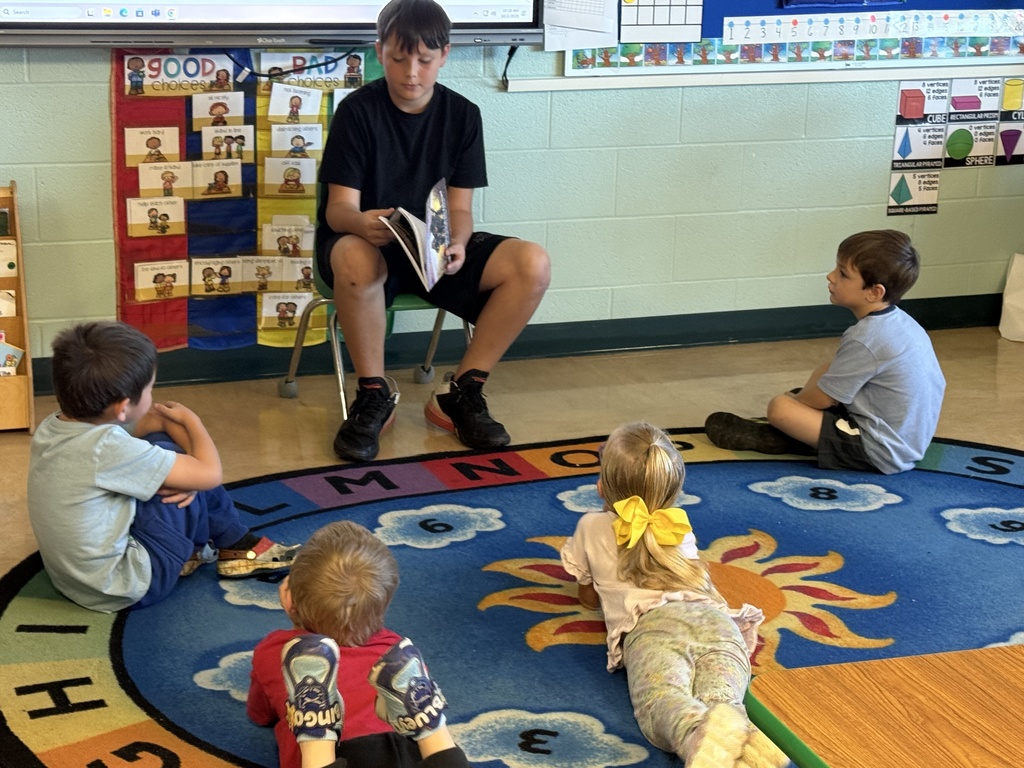 Reading to Primary students. 