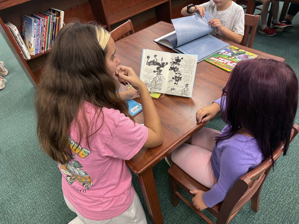 Reading to Primary students. 