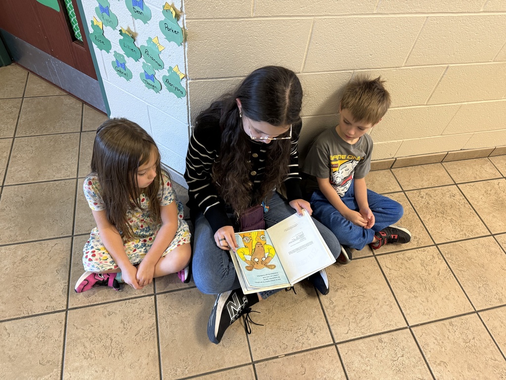Reading to Primary students. 