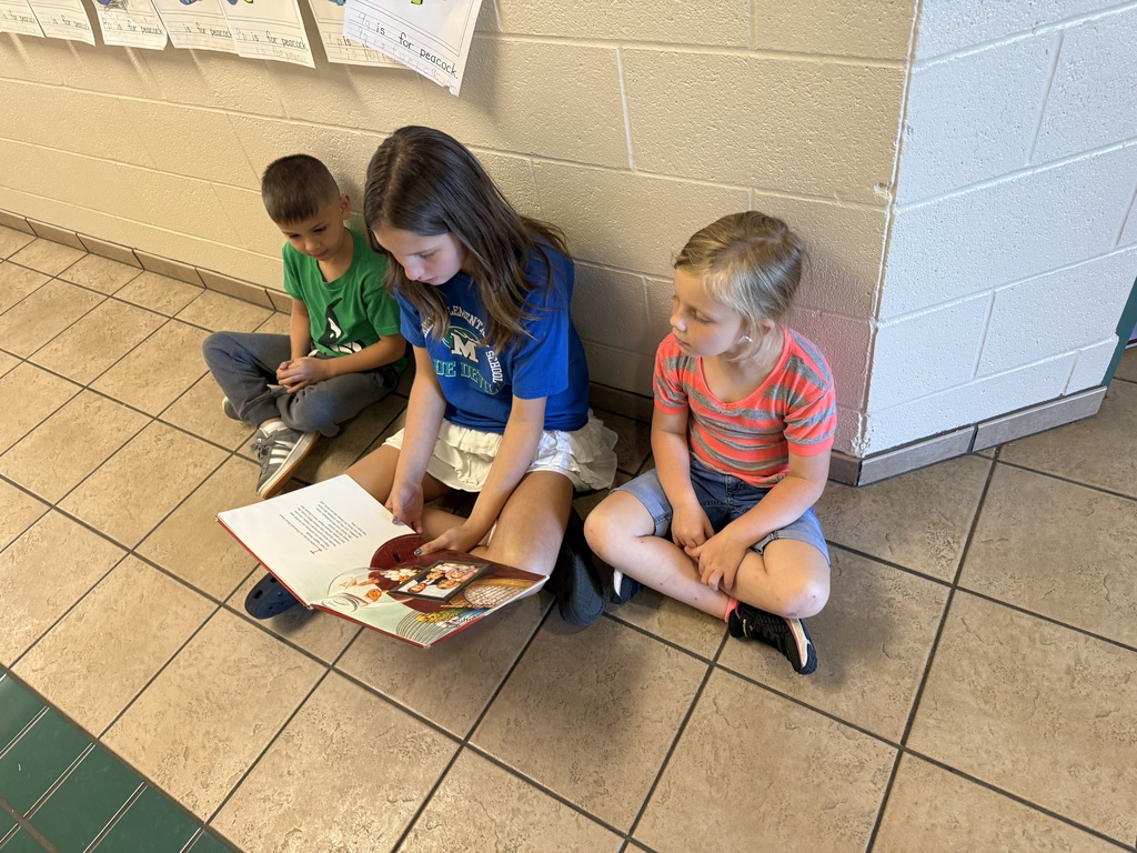 Reading to Primary students. 