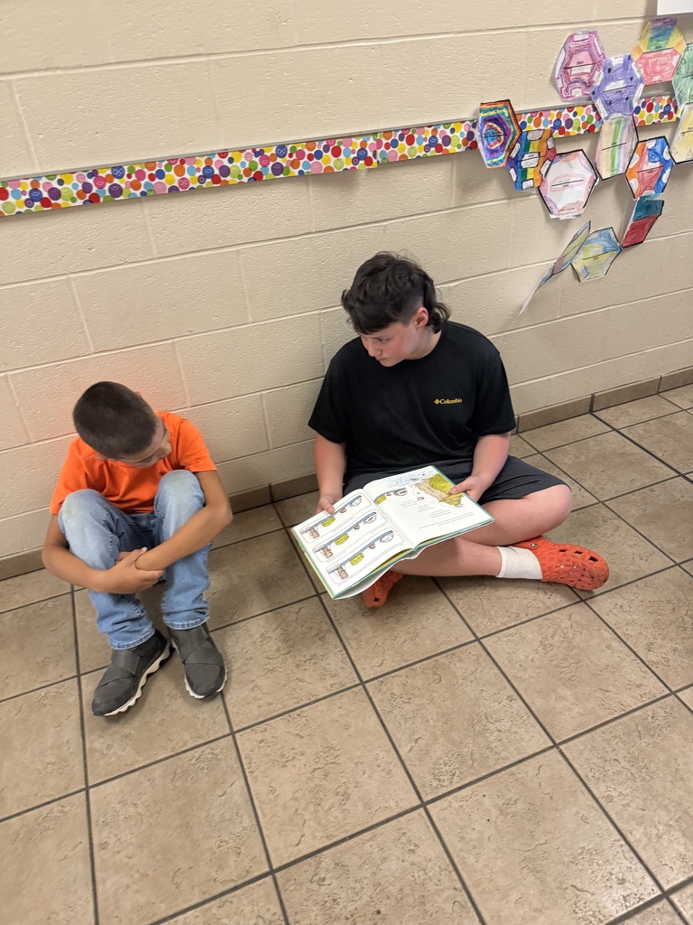 Reading to Primary students. 