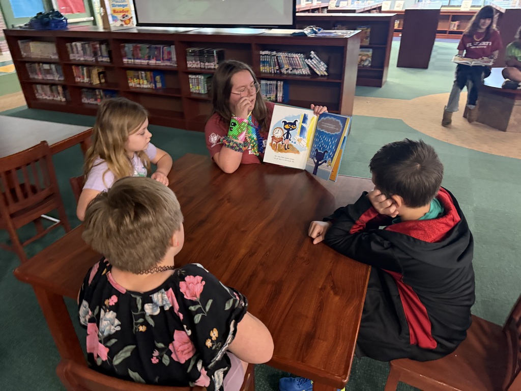 Reading to Primary students. 